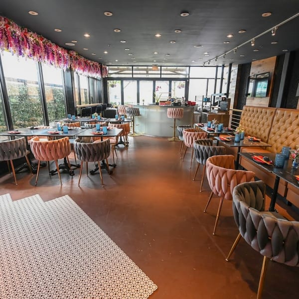 Akeno Sushi Bar and Thai's dining room with tables, chairs, booths, and a bar area.
